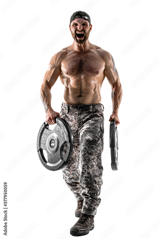 Muscular athlete bodybuilder man in camouflage pants with a naked torso workout with dumbbell on a white background. Isolate