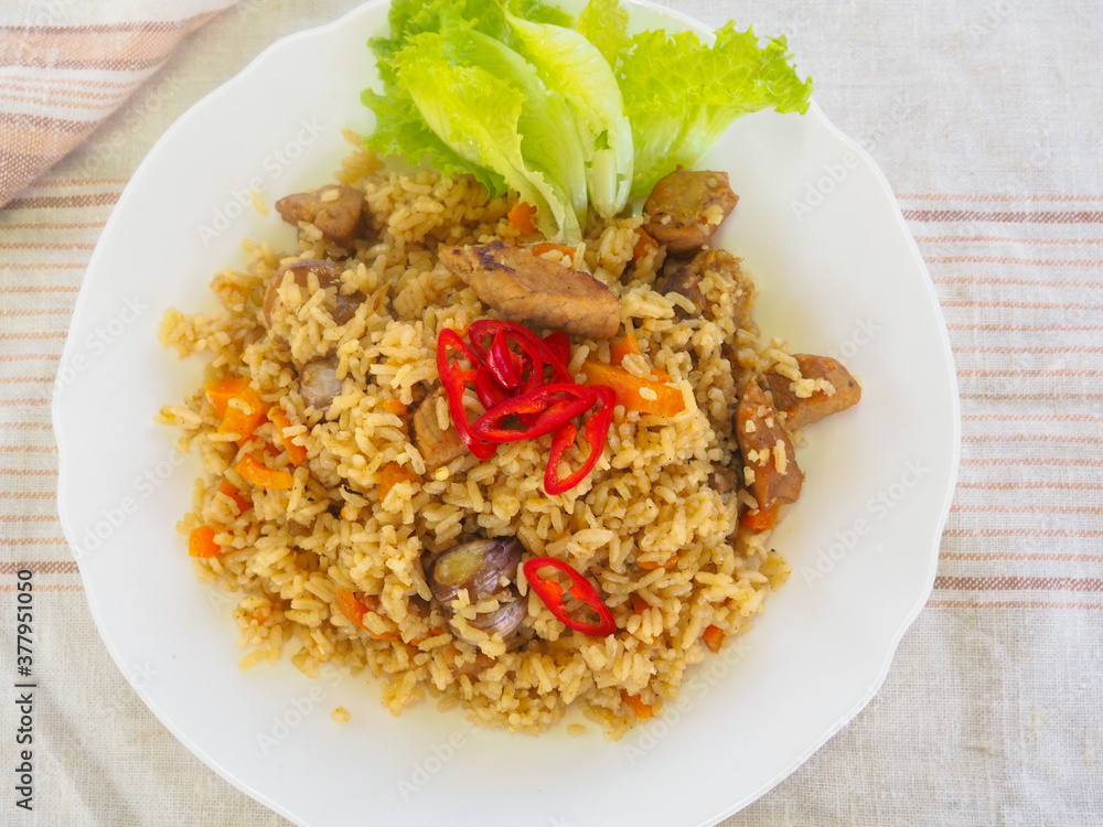plate with pilaf, hot pepper and herbs. national cuisine. Oriental food. plate with pilaf, hot pepper and herbs. national cuisine. Oriental food.