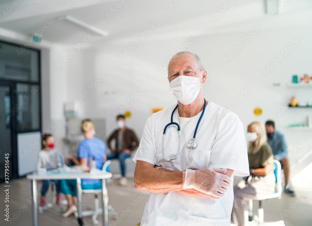 Portrait of doctor with face mask looking at camera, coronavirus, covid-19 and vaccination concept. Portrait of doctor with face mask looking at camera, coronavirus, covid-19 and vaccination concept.