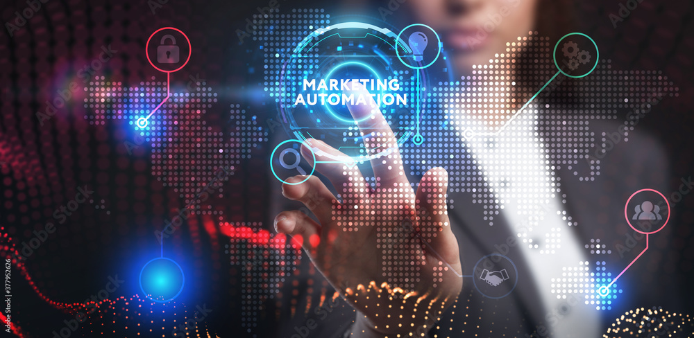 Business, Technology, Internet and network concept. Young businessman working on a virtual screen of the future and sees the inscription: Marketing automation Business, Technology, Internet and network concept. Young businessman working on a virtual screen of the future and sees the inscription: Marketing automation