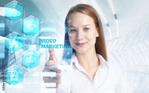 Business, Technology, Internet and network concept. Young businessman working on a virtual screen of the future and sees the inscription: Video marketing