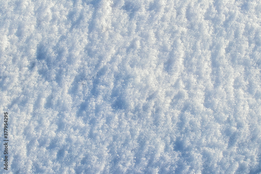 Snow texture in sunny weather, winter background