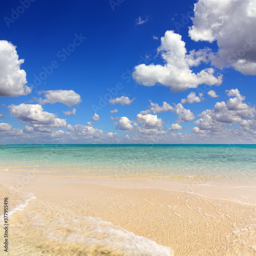 Beautiful landscape with white sandy sea spit beach and warm tropical ocean