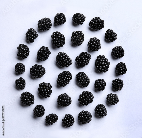 Flat lay composition with ripe blackberries on white background