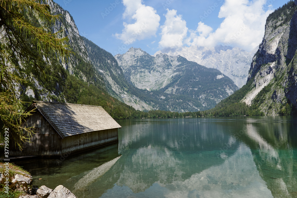 Boathouse at lake Obersee and scenic landscape in Schoenau am Koenigssee, Bavaria, Germany