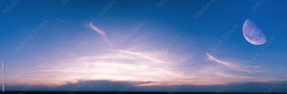 Obraz premium Panorama, cloudy sky at sunset. Pink clouds.