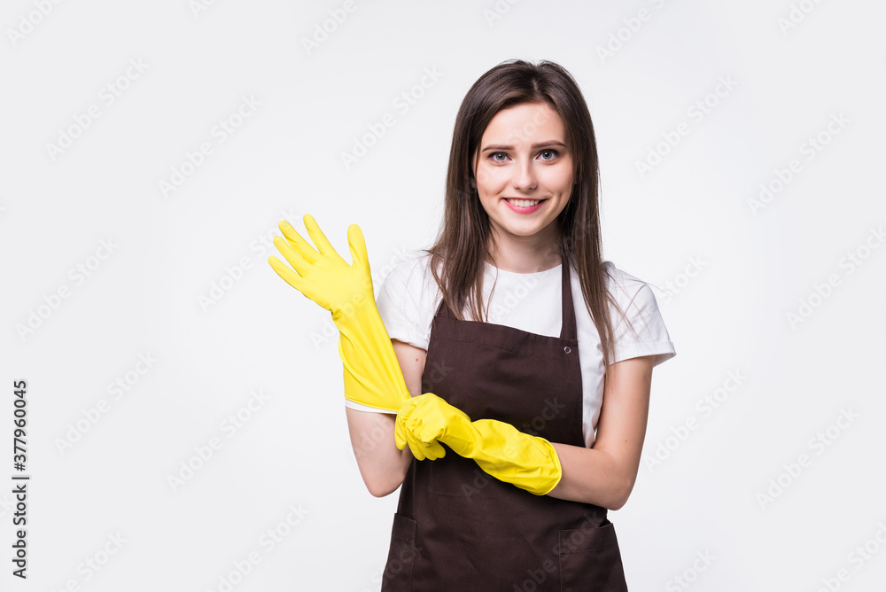 Portrait of young attractive housewife isolated on white background. Housekeeper woman wearing rubber gloves. Cleaner housewife worker lifestyle concept. Portrait of young attractive housewife isolated on white background. Housekeeper woman wearing rubber gloves. Cleaner housewife worker lifestyle concept.