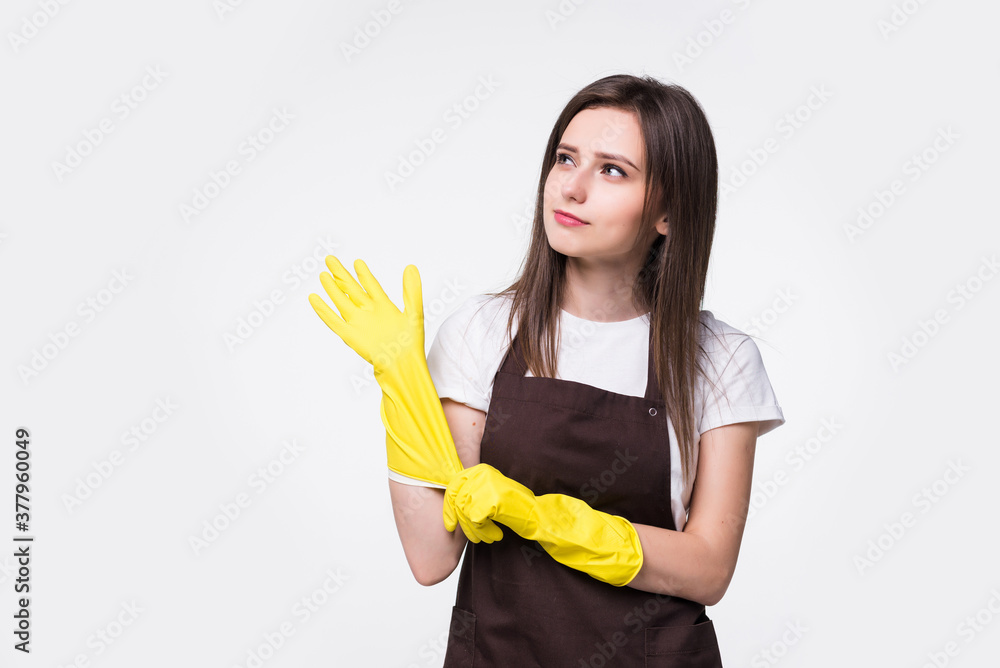 Portrait of young attractive housewife isolated on white background. Housekeeper woman wearing rubber gloves. Cleaner housewife worker lifestyle concept. Portrait of young attractive housewife isolated on white background. Housekeeper woman wearing rubber gloves. Cleaner housewife worker lifestyle concept.