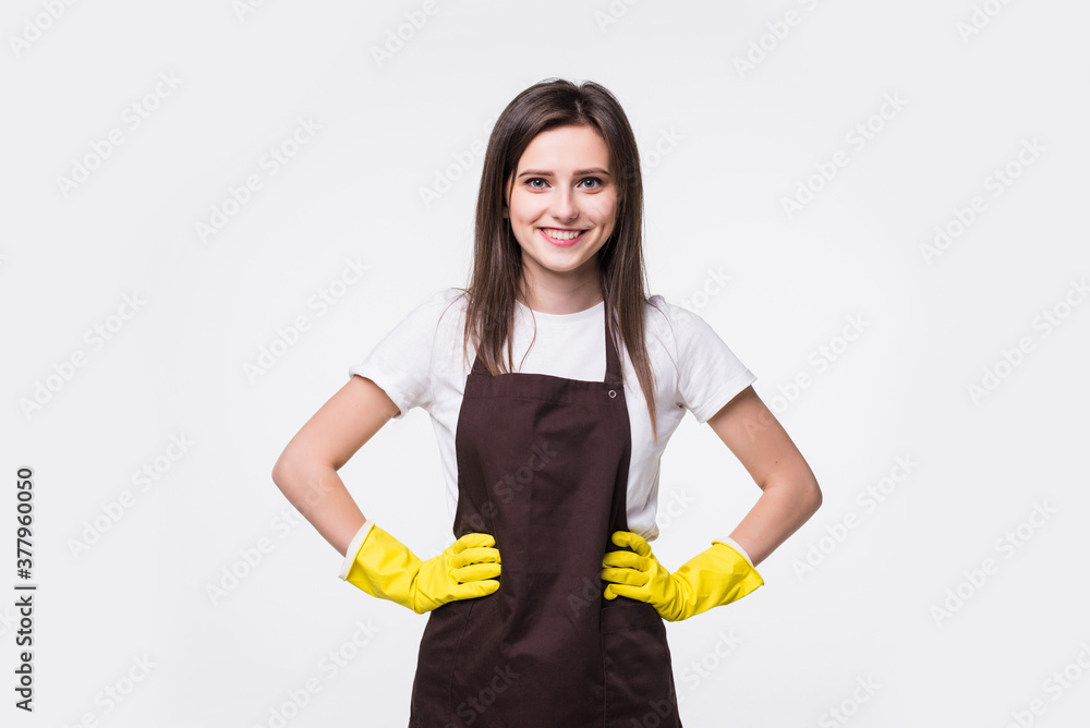 Portrait of young maid holding cleaning spray bottle on white background Portrait of young maid holding cleaning spray bottle on white background