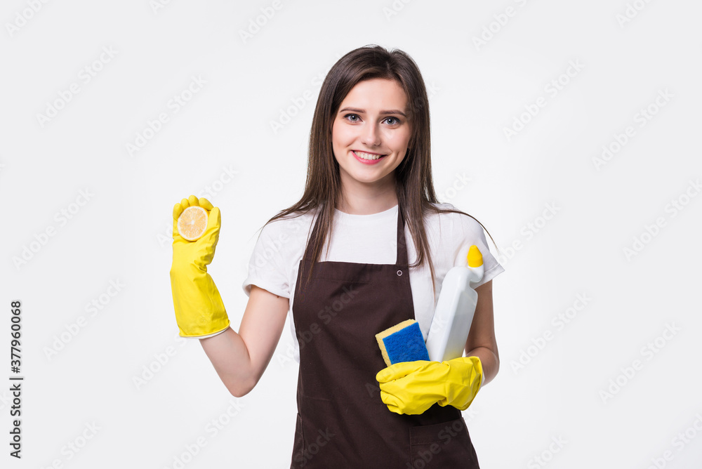 Cleaning woman standing and holding sponge against white background Cleaning woman standing and holding sponge against white background
