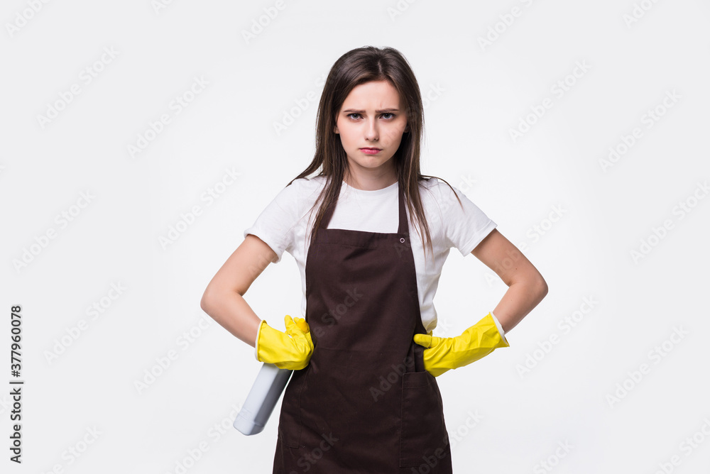 Young housewife in apron, yellow gloves isolated on white background. Young housewife in apron, yellow gloves isolated on white background.