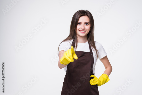 Young beautiful woman cleaner pointing with hand and finger standing over isolated white background