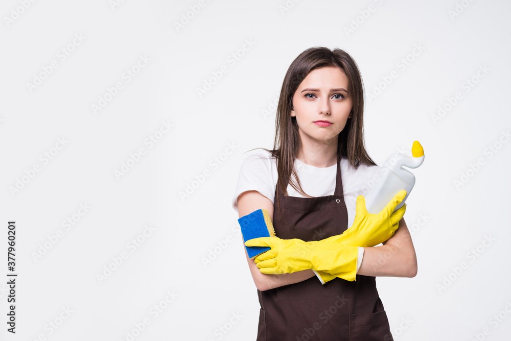 Young housewife cleaning detergent on white background Young housewife cleaning detergent on white background