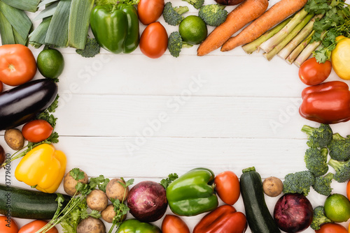 Fototapeta Naklejka Na Ścianę i Meble -  top view of fresh ripe vegetables and fruits on wooden white background