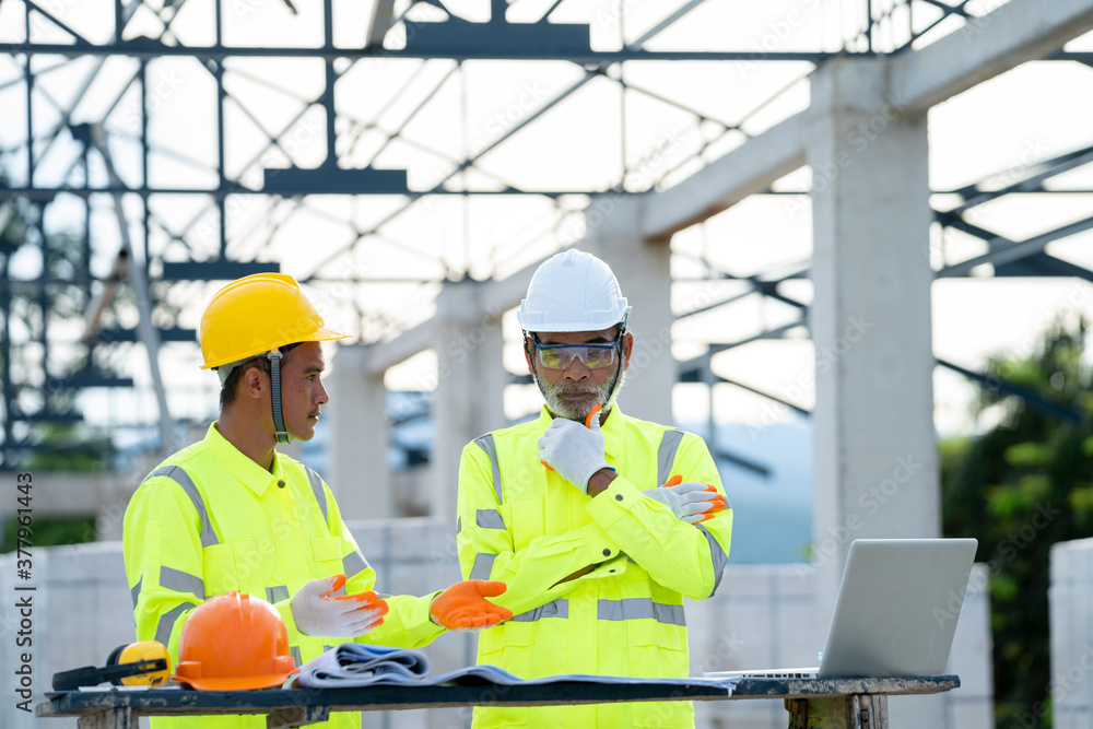 Engineer and architect discussing meeting with blueprint and ideas about building structure on construction site. Engineer and architect discussing meeting with blueprint and ideas about building structure on construction site.