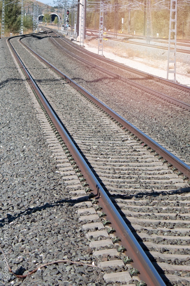 train tracks with the power poles
