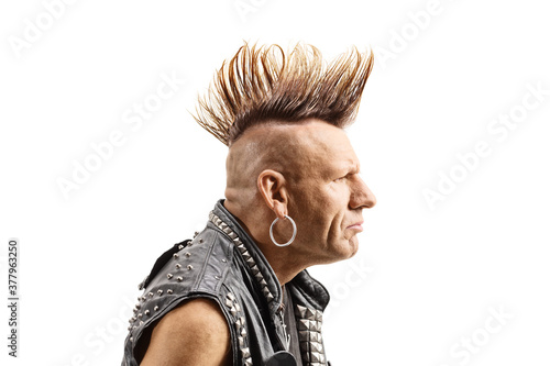 Profile shot of a middle aged punker with a mohawk photo