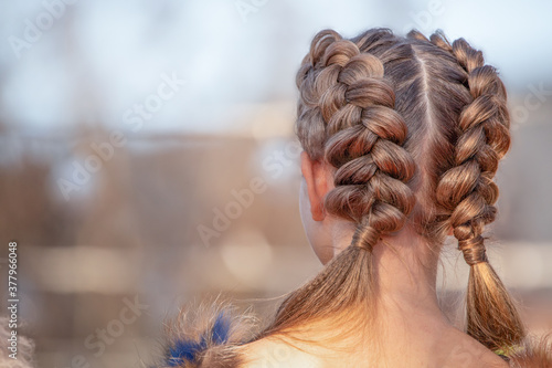 Hairstyle French braid inside out, on the head of a young girl. photo