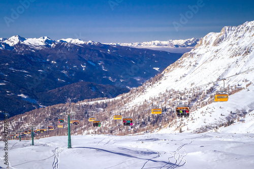 Sunny winter landscape at Ski Area in Dolomites, Italy - Alpe Lusia. Ski resort in val di Fassa near Moena photo