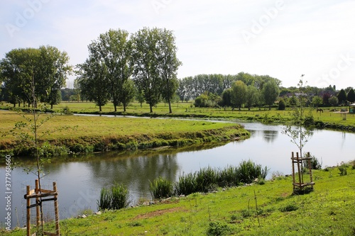 View over green pasture on river roer near Sint Odilienberg, Netherlands (focus on horizon) photo