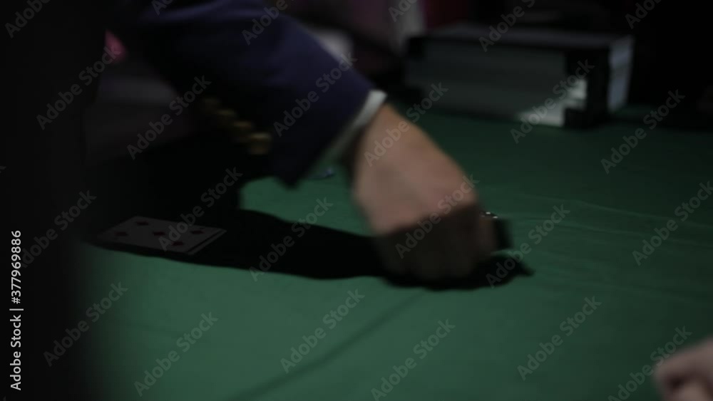 People secretly play cards, card games shot from behind people. Poker in closed clubs. People secretly play cards, card games shot from behind people. Poker in closed clubs.