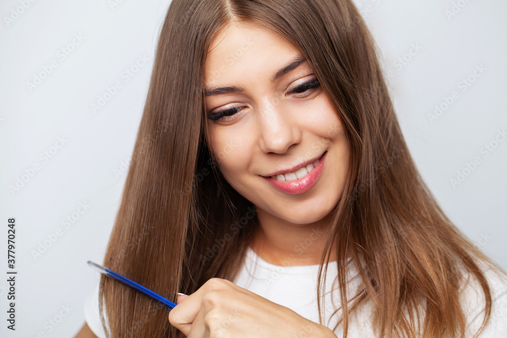 Closeup Of Beautiful Woman Hairbrushing Hair With Brush Closeup Of Beautiful Woman Hairbrushing Hair With Brush