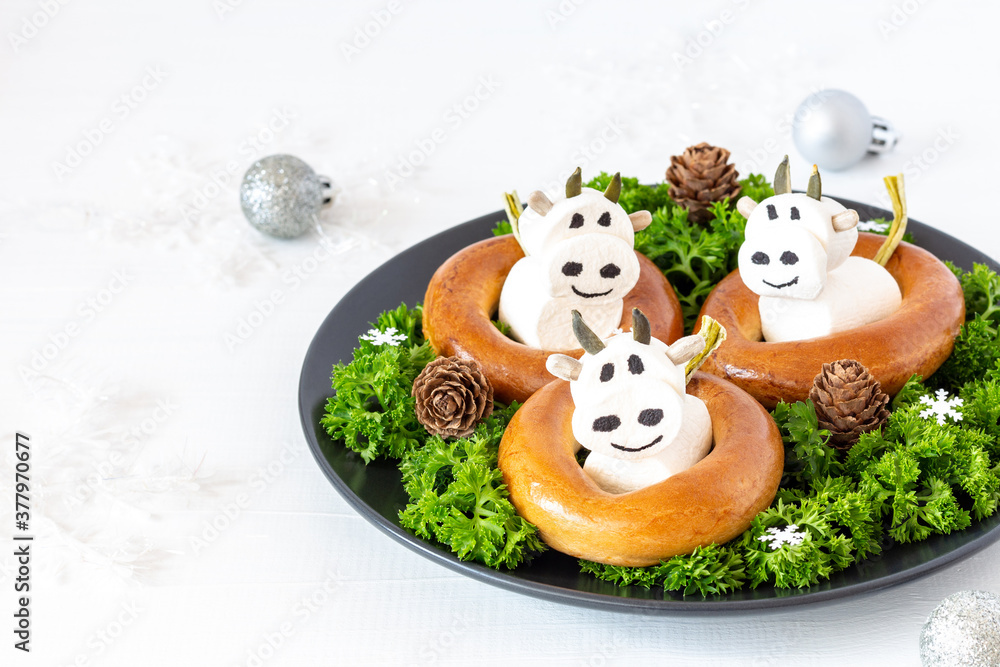 Cow (bull) from marshmallows. Festive food decoration for New Year (Chinese) or Christmas. Copy space Cow (bull) from marshmallows. Festive food decoration for New Year (Chinese) or Christmas. Copy space