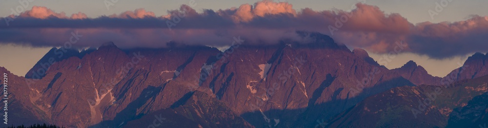 mountain peaks lit by the setting sun
