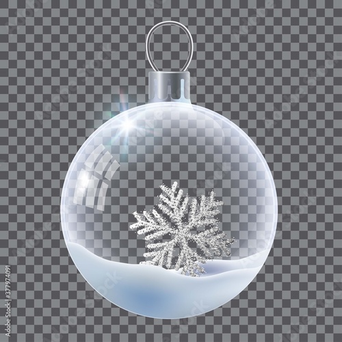 Vector realistic transparent Christmas ball with snow and snowflake. Template of glass transparent Christmas ball. Vector object for design, mock-up. Shiny toy with silver glow.