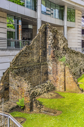 Ancient remains of old Roman city walls in London. Defensive London Wall, built to protect the Roman settlement of Londinium in the second - third century. London, UK. photo