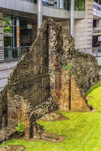 Ancient remains of old Roman city walls in London. Defensive London Wall, built to protect the Roman settlement of Londinium in the second - third century. London, UK. photo