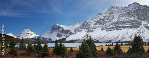 Sunlight on Bow Lake and Peak with Crowfoot mountain and Glacier