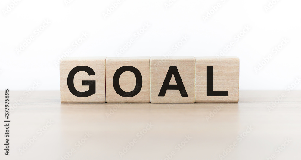 GOAL word written on wood block. goal text on table, concept. GOAL word written on wood block. goal text on table, concept.