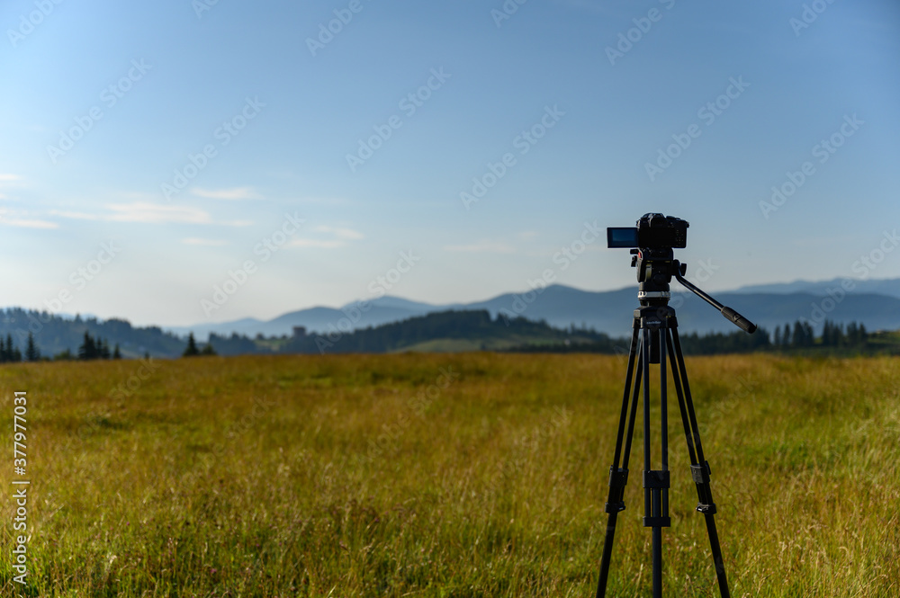 camera with tripod take photo on mountain beautiful view camera with tripod take photo on mountain beautiful view
