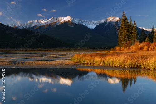 First light on Sundance Range at First Vermilion Lake in the Fall