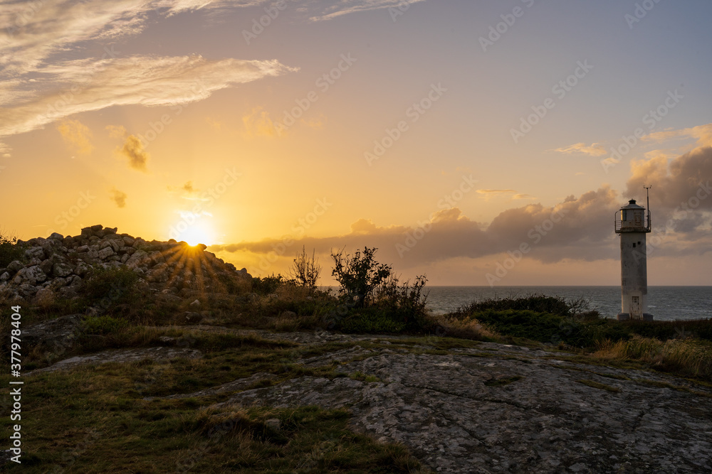 Subbe lighthouse during golden sunset in southern Varberg, Sweden. Nature background.