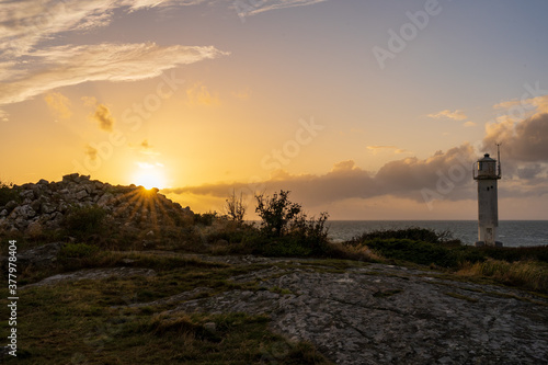 Subbe lighthouse during golden sunset in southern Varberg, Sweden. Nature background.