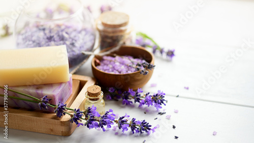 Lavender soap and Spa products with lavender flowers on a white table. photo