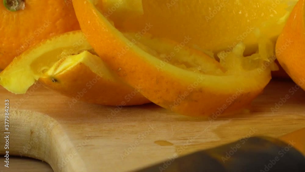 Close-up of knife and sliced oranges on cutting board Close-up of knife and sliced oranges on cutting board