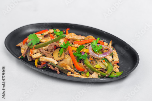 Chicken mushroom and capsicum stir fry recipe served on a sizzling plate. Chicken Fajita Recipe  Asian recipes.
