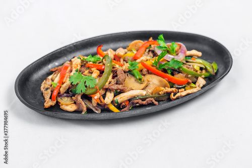 Chicken mushroom and capsicum stir fry recipe served on a sizzling plate. Chicken Fajita Recipe, Asian recipes.