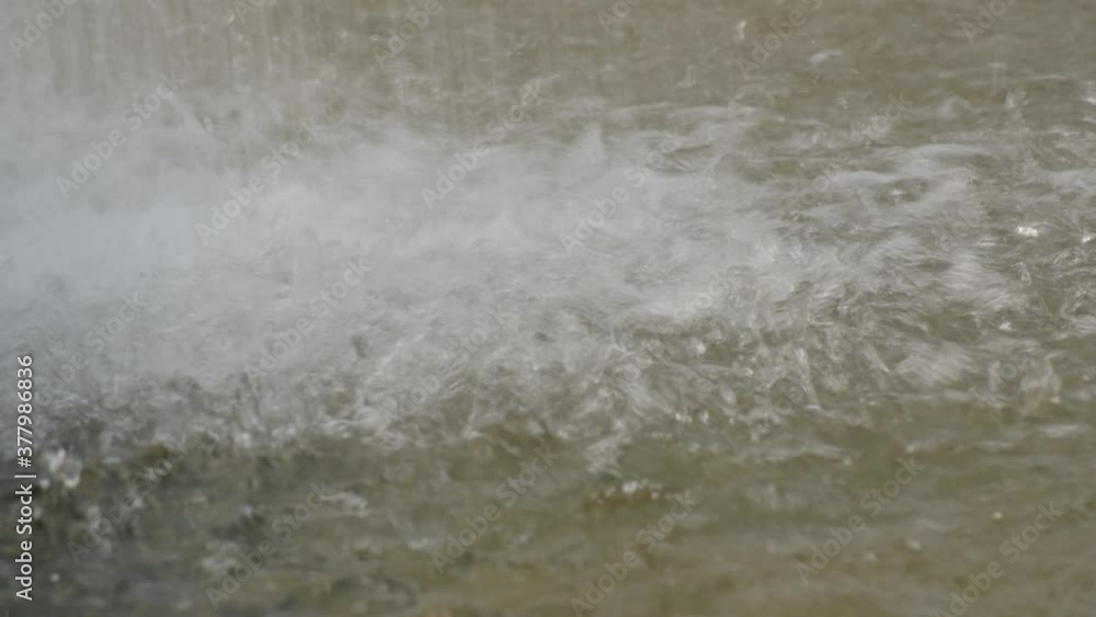 Splashes from jets of water from the fountain fall onto the surface of the pool. Splashes from jets of water from the fountain fall onto the surface of the pool.