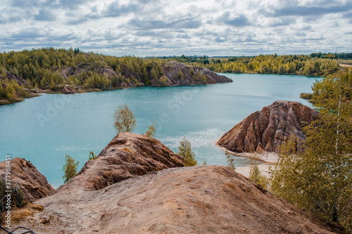 Konduki (Conduky) village, Tula region, Romancevskie mountains, Abandoned Ushakov quarries. Turquoise water lakes and the mud erosion of the soil looks like mountains. Beautiful natural landscape. photo