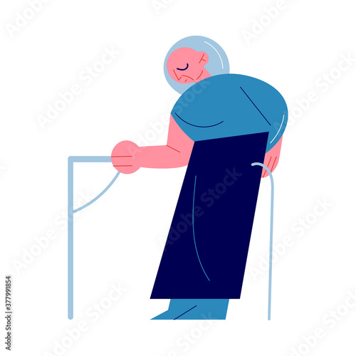 Old woman with club standing in subway coach and holding on to handrail