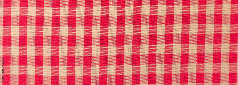 Close up of a red and white checkered tablecloth Close up of a red and white checkered tablecloth