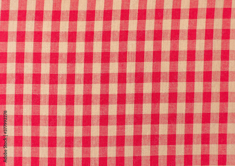Close up of a red and white checkered tablecloth