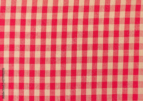Close up of a red and white checkered tablecloth