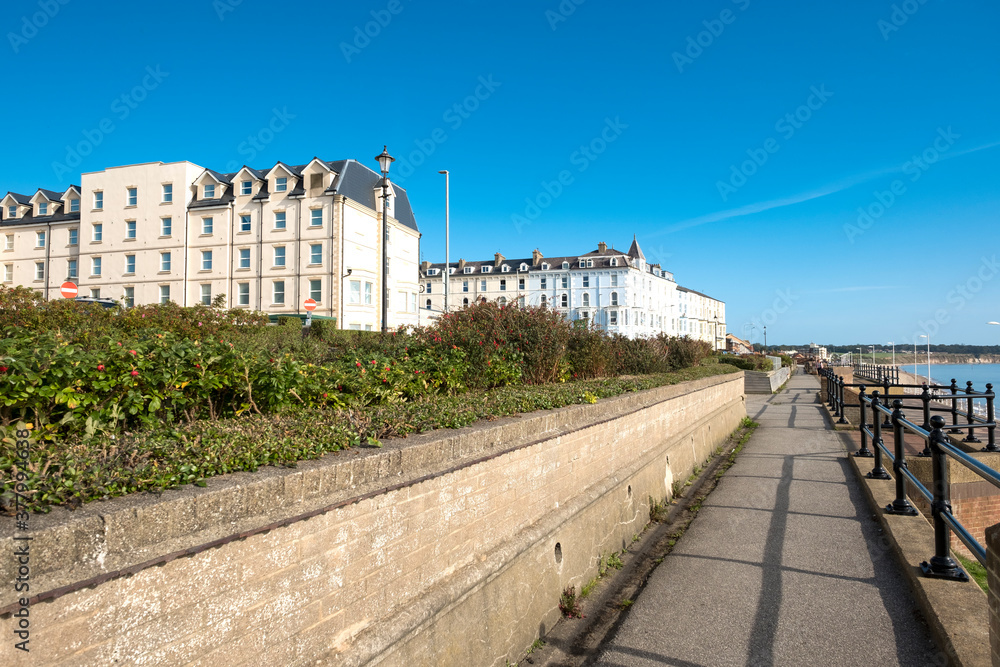 Sea front promenade and buildings on a sunny day
