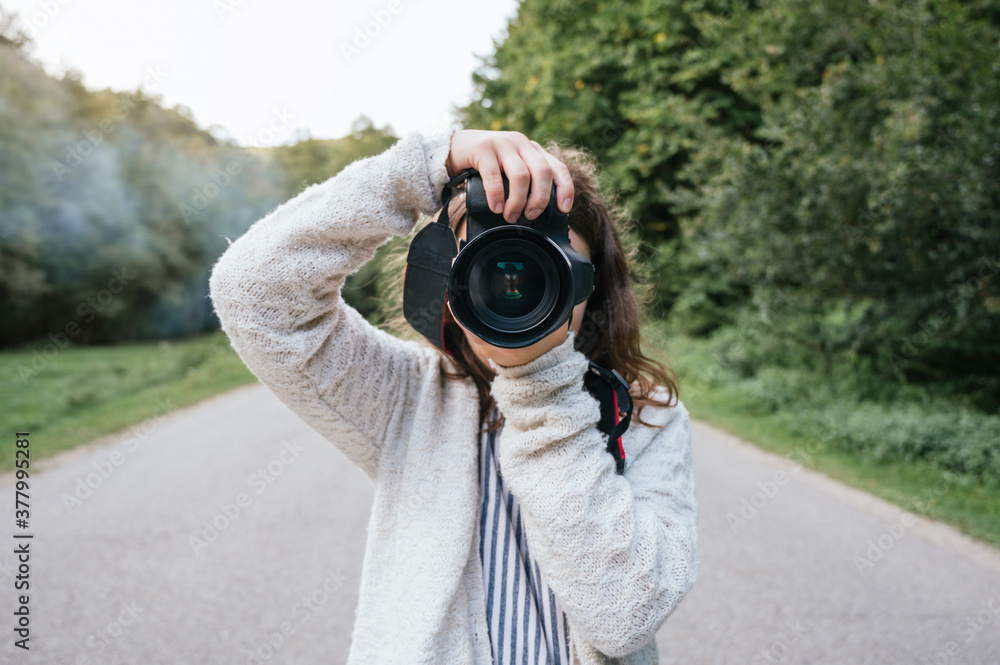 Fototapeta premium Professional photographer taking photos outdoors