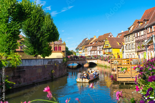 Fototapeta Naklejka Na Ścianę i Meble -  Spectacular colorful traditional french houses on the side of river Lauch in Petite Venise,Colmar,France.